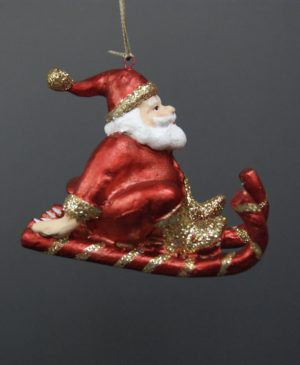 Small santa on sled red
