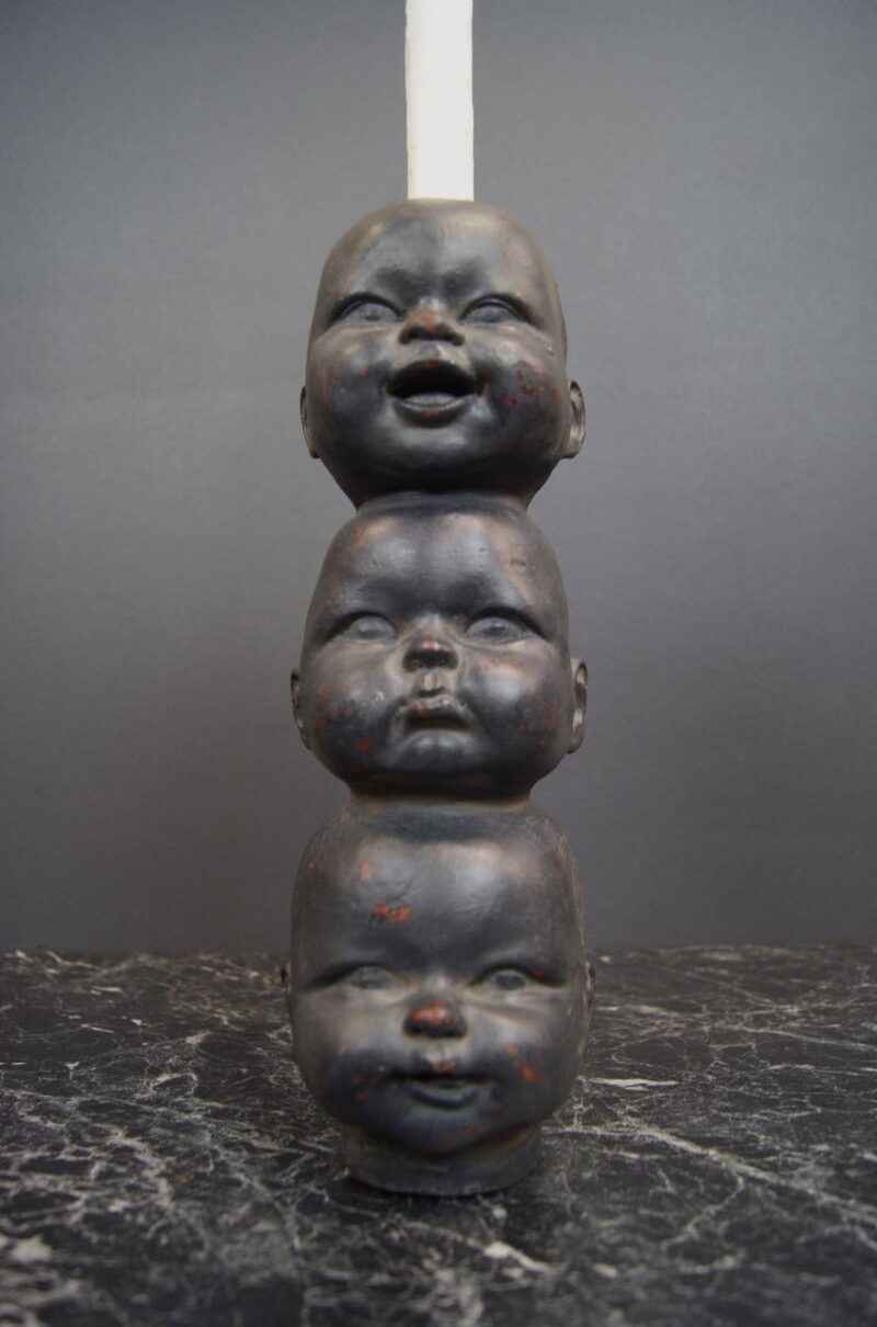 Baby doll head triple black