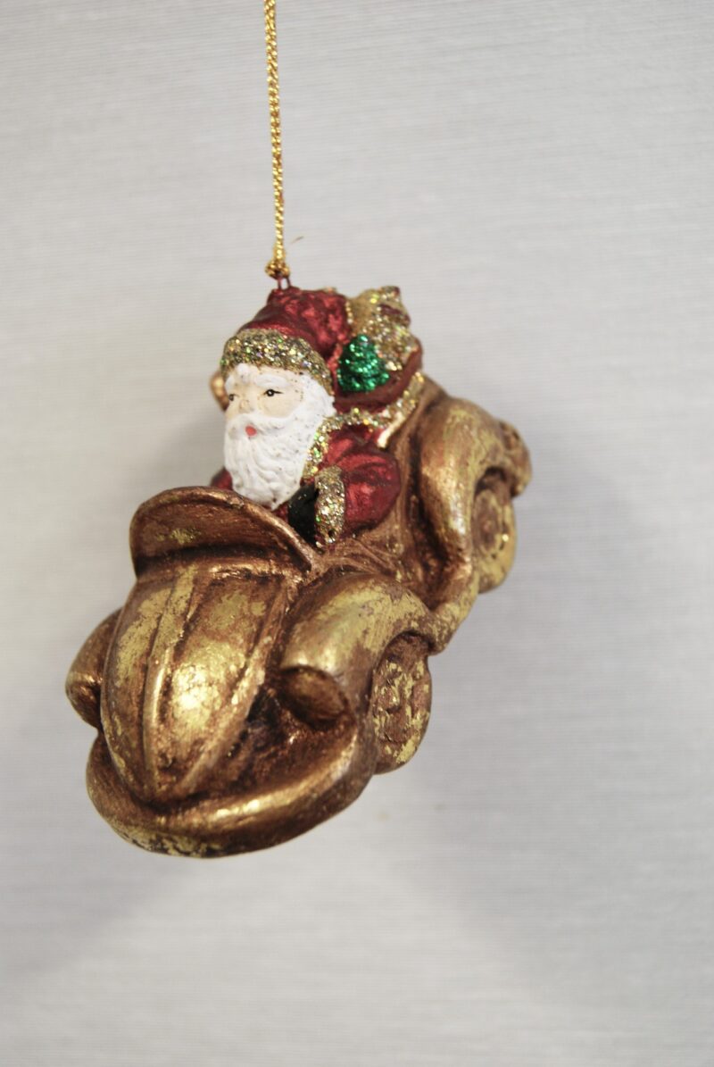Santa riding on toy car red