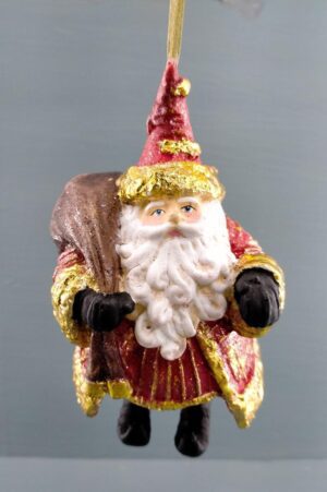 Standing Santa holding bag gold leaf details