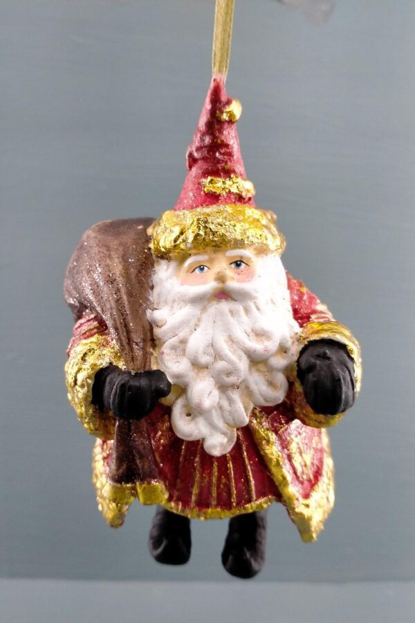 Standing Santa holding bag gold leaf details