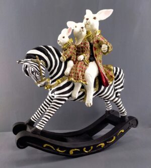 Family rabbit on rocking zebra