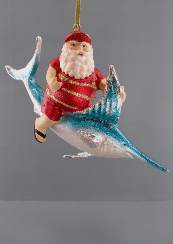 Santa riding on pearlized swordfish