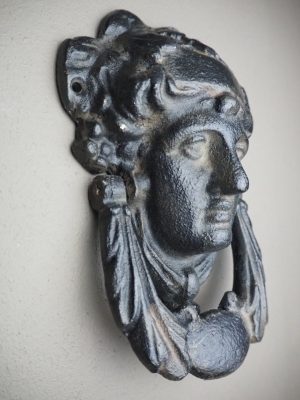 Weathered Athena iron knocker