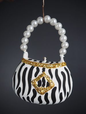 Bag orn with zebra design & gold glits with pearl handle