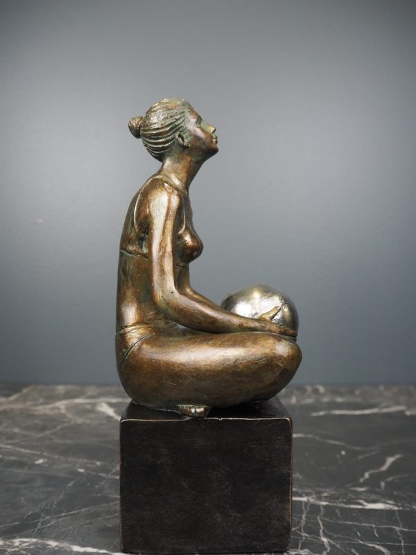 Woman holding ball - Image 2
