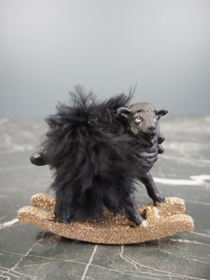 Rocking lamb in black w/ feather orn