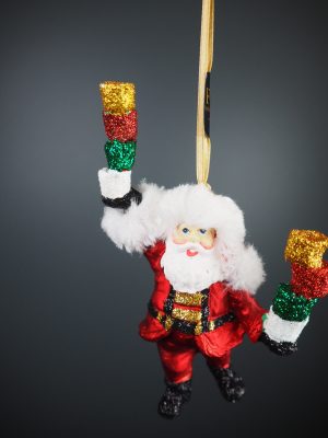 Santa holding colorful cholate tower in satin red with fur o