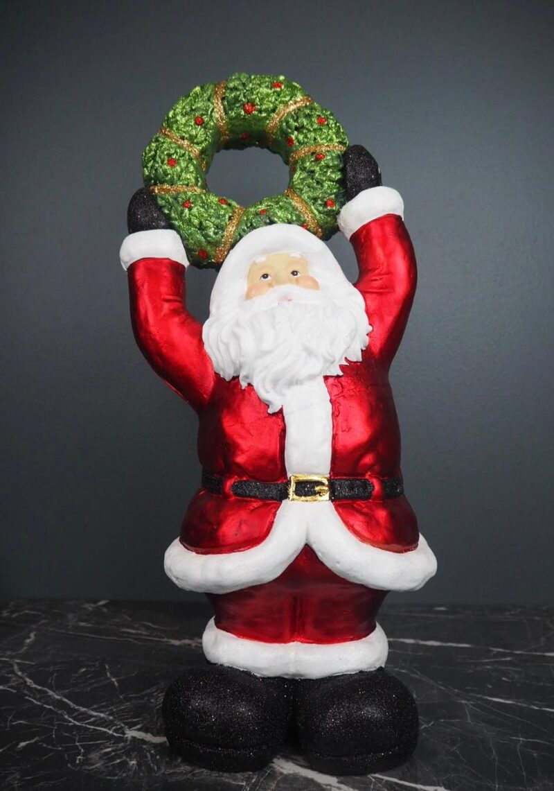 Santa holding wreath