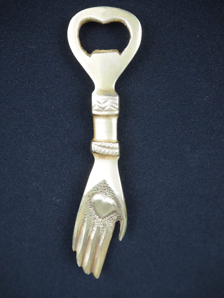 Brass hand bottle opener