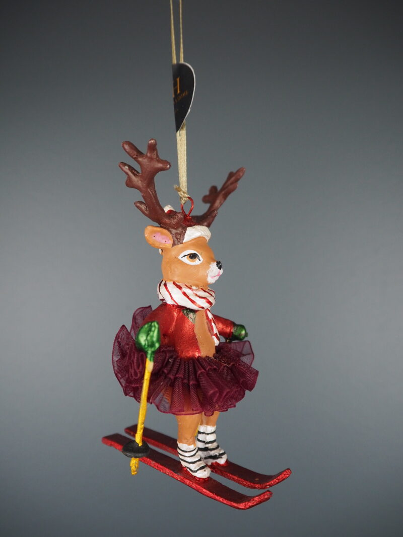 Skiing deer in red w/ fabskirt orn